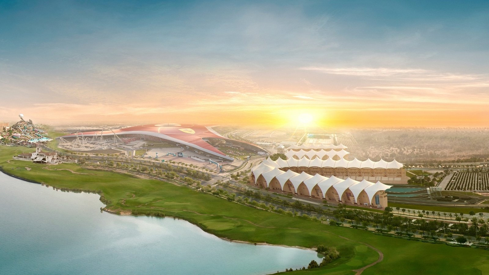 yas island real estate stadiums by a serene waterfront sunset.